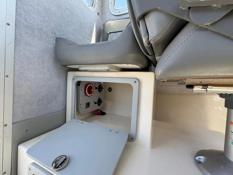 Slide: The Image of 2023 Defiance Admiral 220 EX boat interior with open storage compartment. - 31