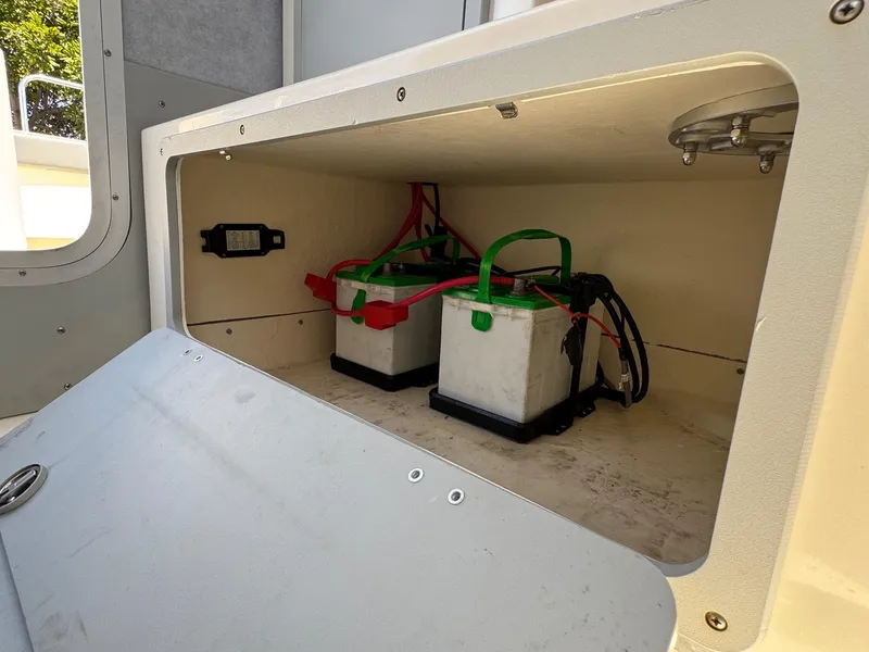 Slide: The Image of 2023 Defiance Admiral 220 EX boat docked at marina under clear blue sky. - 32