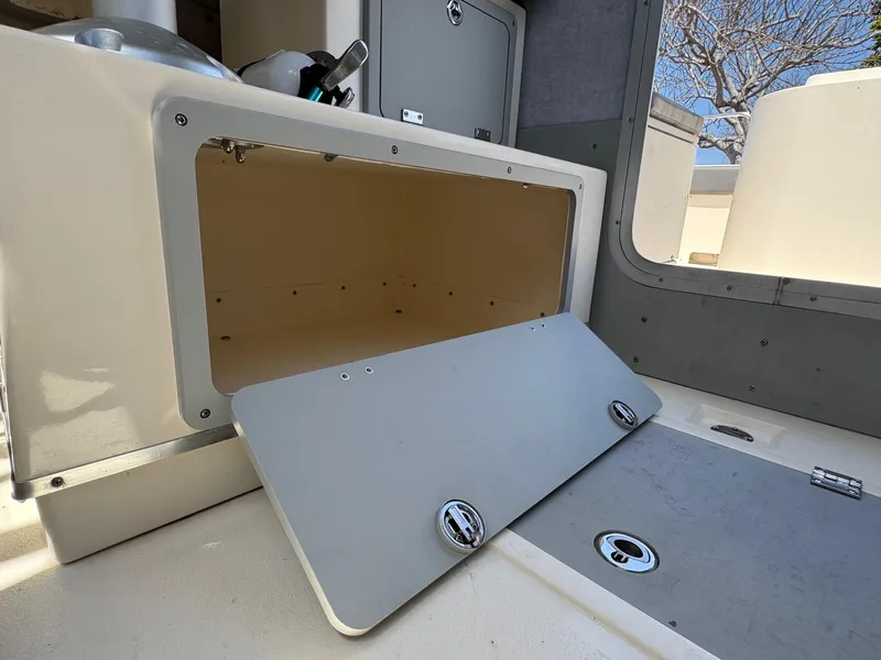 Slide: The Image of Interior of 2023 Defiance Admiral 220 EX boat with modern helm and seating. - 34