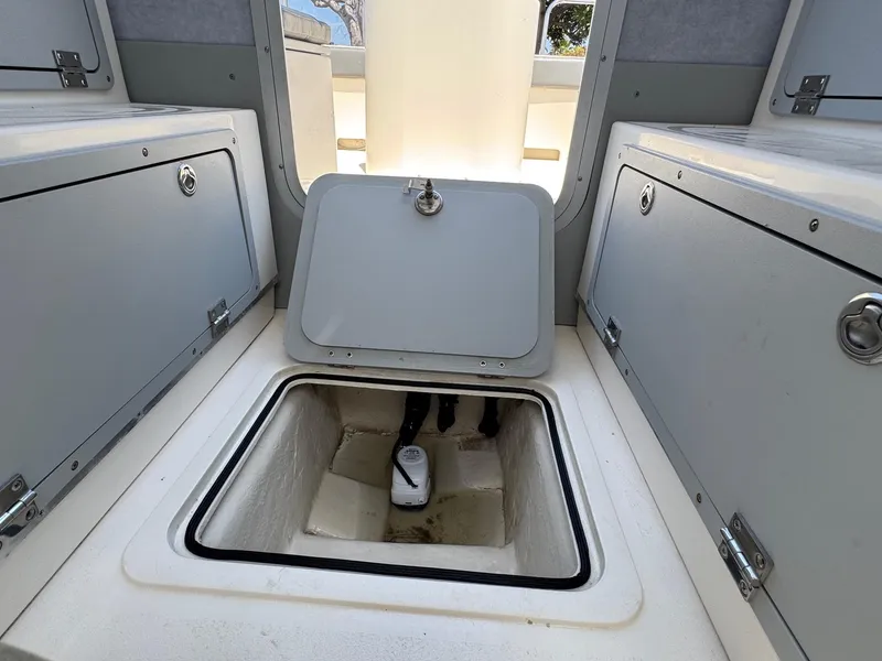 Slide: The Image of Interior of 2023 Defiance Admiral 220 EX boat with seating and control panel. - 35