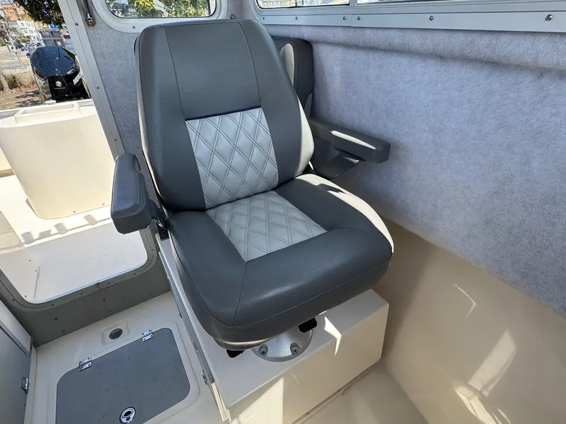 Slide: The Image of 2023 Defiance Admiral 220 EX boat interior with seating and storage compartments. - 37