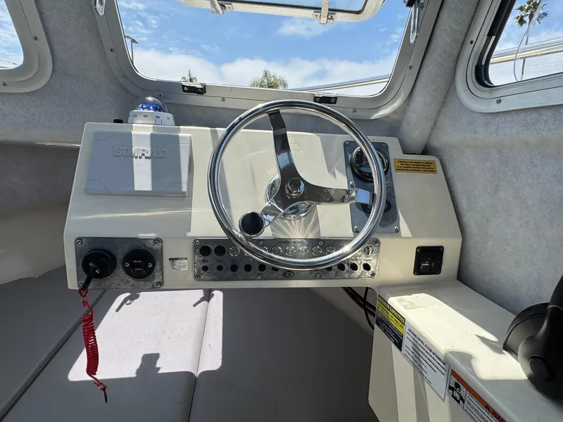 Slide: The Image of 2023 Defiance Admiral 220 EX boat compartment with electrical panel and wiring. - 41