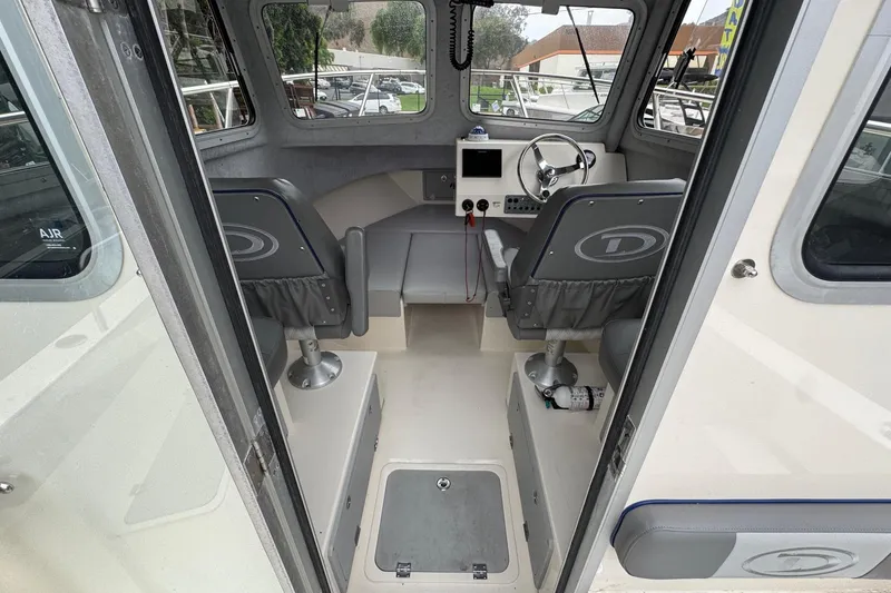 Slide: The Image of 2023 Defiance Admiral 220 EX boat battery compartment with two batteries. - 42