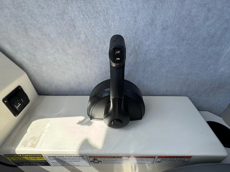 Slide: The Image of 2023 Defiance Admiral 220 EX cabin interior with cushioned seating and control panel. - 43