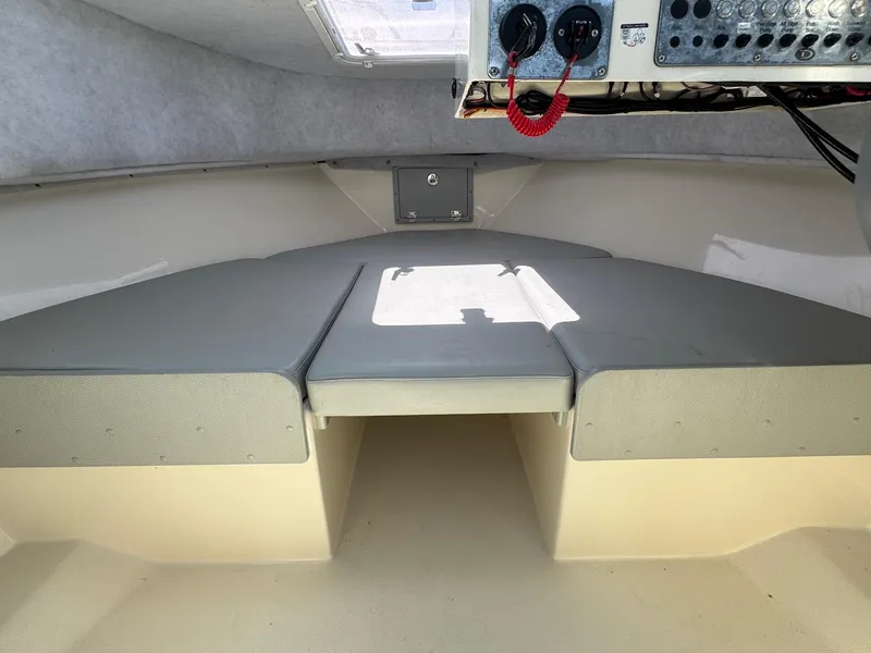 Slide: The Image of Helm of 2023 Defiance Admiral 220 EX boat with steering wheel and navigation display. - 44