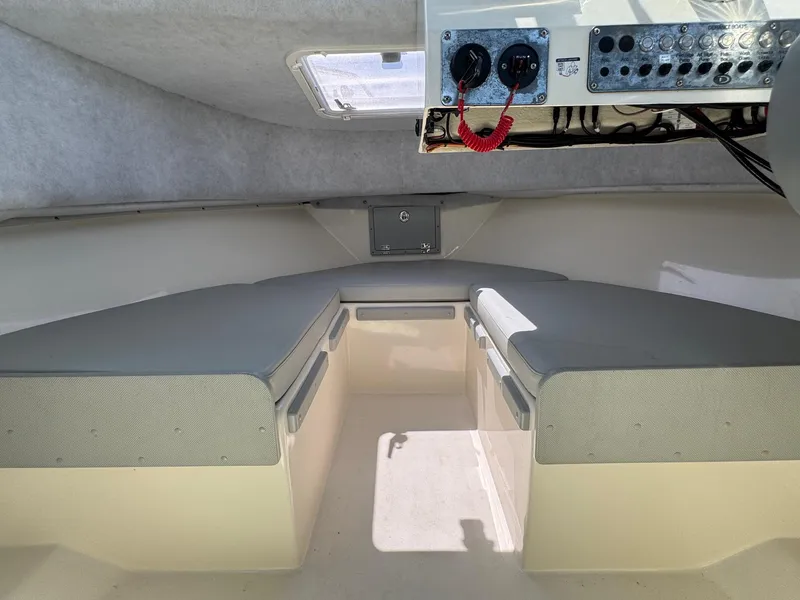 Slide: The Image of 2023 Defiance Admiral 220 EX boat controls with capacity and warning labels. - 45