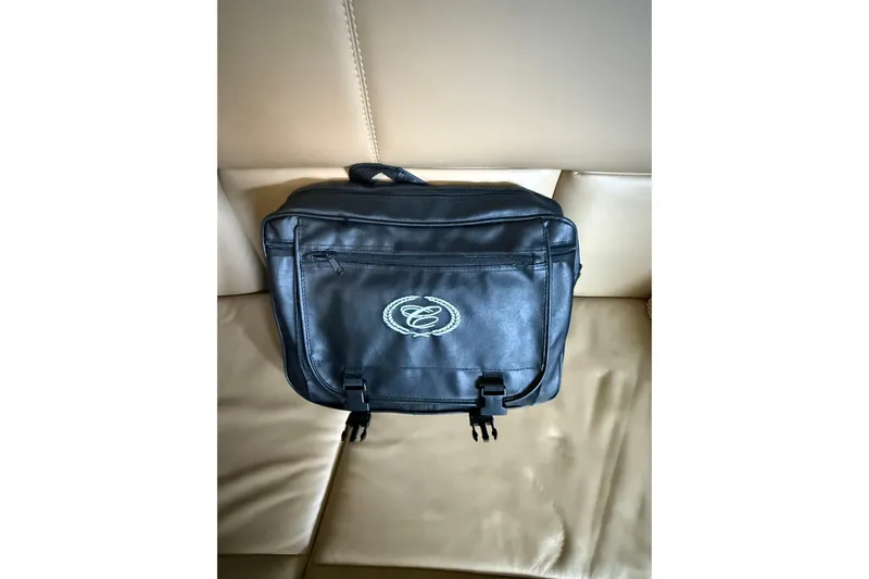 Slide: The Image of Black leather bag with Cobalt logo on beige seat, 2018 model R35. - 13