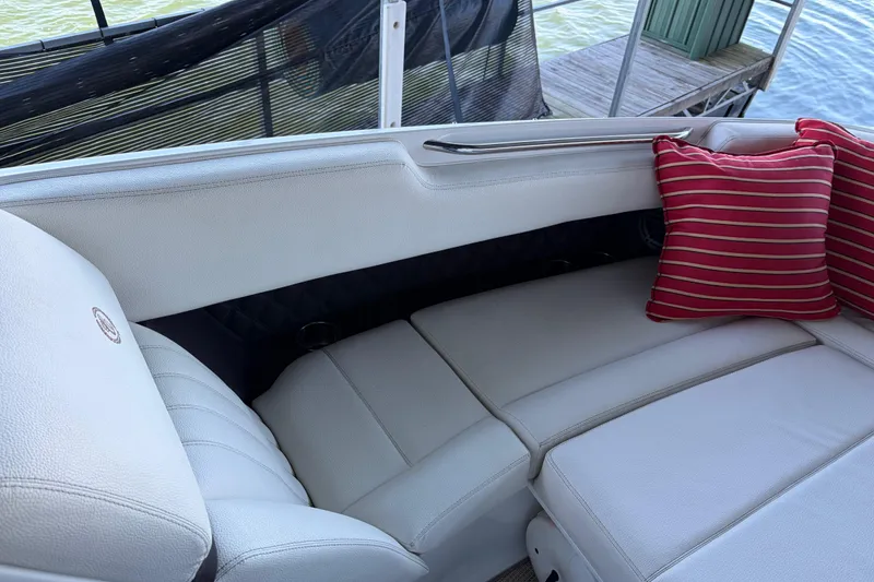 Slide: The Image of Luxurious seating on 2018 Cobalt R35 boat with red striped cushion. - 19