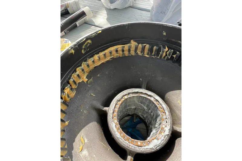 Slide: The Image of Close-up of F&C 44 machinery part with visible grease, 1980 model. - 23