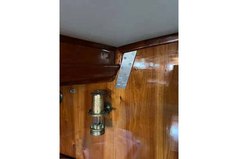 Slide: The Image of Polished wooden interior with vintage lamp on 1980 F&C 44 model boat. - 31