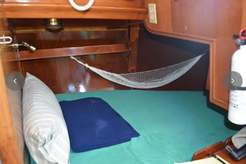 Slide: The Image of Cozy cabin interior of 1980 F&C 44 yacht with hammock and bedding. - 41