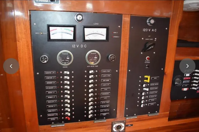 Slide: The Image of Electrical control panel on a 1980 F&C 44 yacht, featuring 12V DC and 120V AC systems. - 44