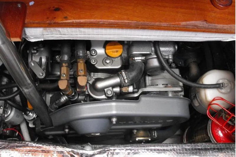 Slide: The Image of Engine of 1980 F&C Model 44, showcasing mechanical components and hoses. - 48