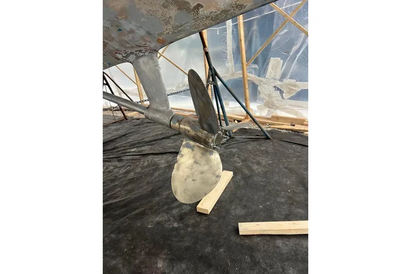 Slide: The Image of Propeller of 1980 F&C 44 boat under maintenance in a workshop setting. - 50