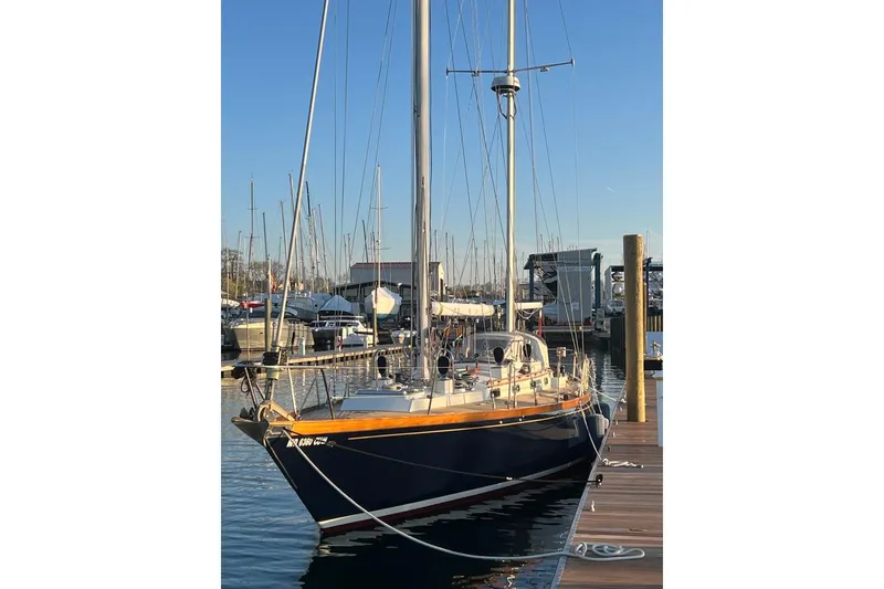 Slide: The Image of Sailboat docked at marina, F&C 44 model, 1980, with clear blue sky. - 9