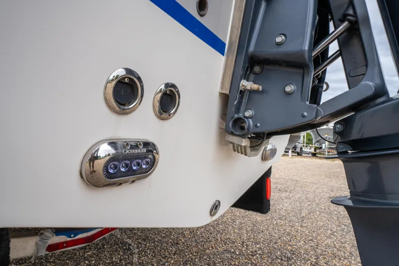 Slide: The Image of 2018 Sea Hunt Ultra 255 SE boat dashboard with steering wheel and navigation system. - 11