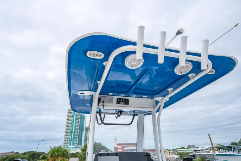 Slide: The Image of 2018 Sea Hunt Ultra 255 SE boat interior with white cushioned seating and storage compartments. - 23