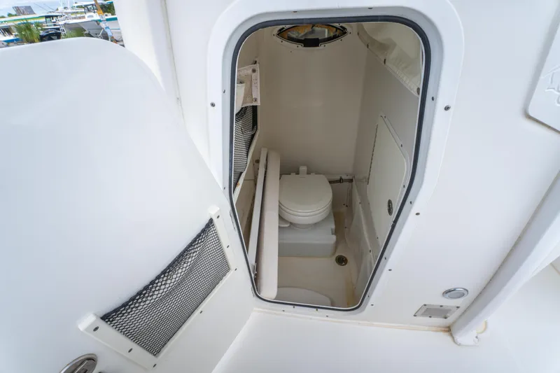 Slide: The Image of 2018 Sea Hunt Ultra 255 SE boat with OceanLED lights and motor detail. - 27