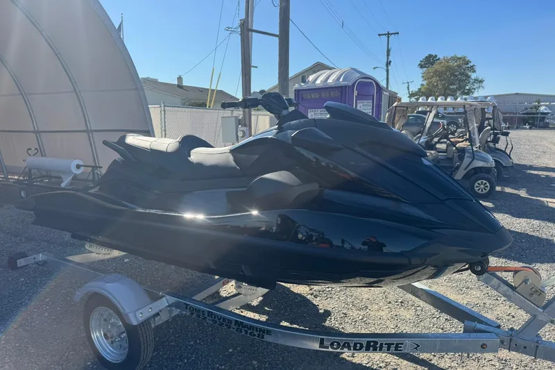 Slide: The Image of 2026 Yamaha WaveRunner GP SVHO on trailer, parked outdoors in a sunny setting. - 2