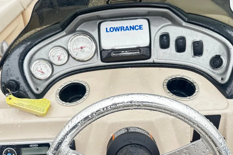Slide: The Image of Dashboard of a 2019 SUNTRACKER Party Barge Pontoon with gauges and Lowrance display. - 5