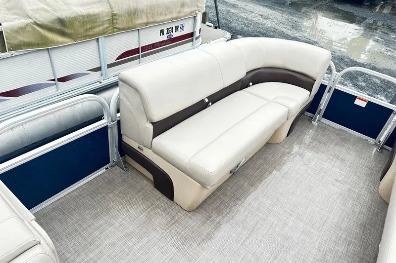 Slide: The Image of 2019 SUNTRACKER Party Barge Pontoon with beige seating and spacious deck. - 9