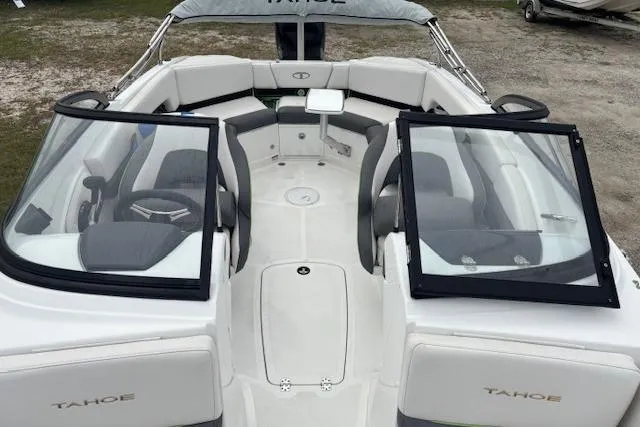 Slide: The Image of 2022 Tahoe 210 S boat interior with open windshield, white and gray seating. - 10