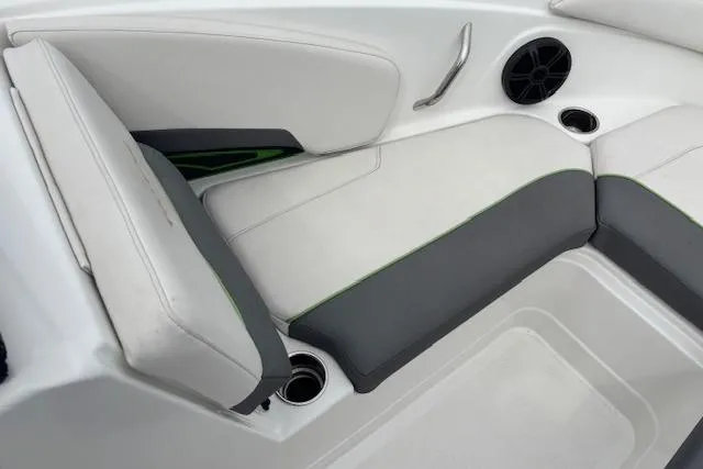 Slide: The Image of Interior seating of 2022 Tahoe 210 S boat with cup holders and speaker. - 13