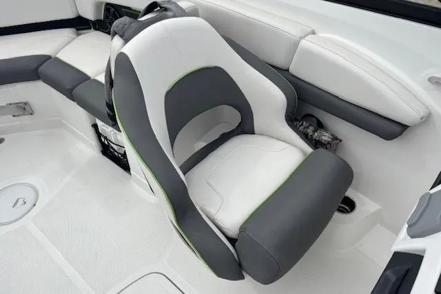 Slide: The Image of 2022 Tahoe 210 S boat interior with white and gray seating. - 14