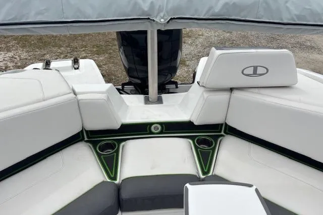 Slide: The Image of 2022 Tahoe 210 S boat interior with white seating and green accents. - 19