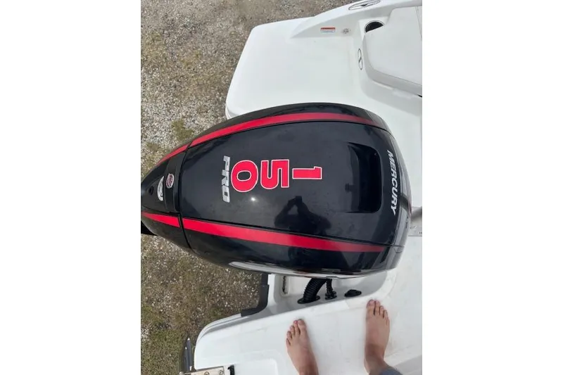 Slide: The Image of Mercury 150 Pro outboard motor on 2022 Tahoe 210 S boat, viewed from above. - 24