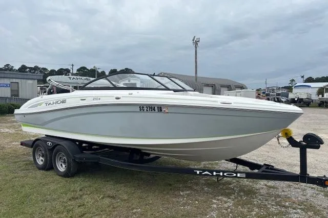 Slide: The Image of 2022 Tahoe 210 S boat on trailer in outdoor setting. - 4