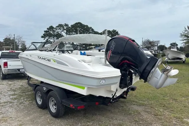 Slide: The Image of 2022 Tahoe 210 S boat on trailer, featuring sleek design and powerful outboard motor. - 8