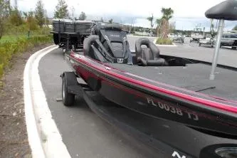 The Image of 2023 Nitro Z18 boat on trailer, parked on a road near a marina. - 0