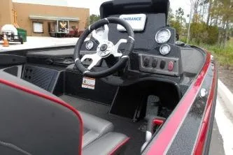 Slide: The Image of 2023 Nitro Z18 boat interior with steering wheel and dashboard controls. - 3