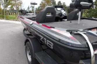 Slide: The Image of 2023 Nitro Z18 boat, sleek design, parked outdoors, showcasing modern features. - 4