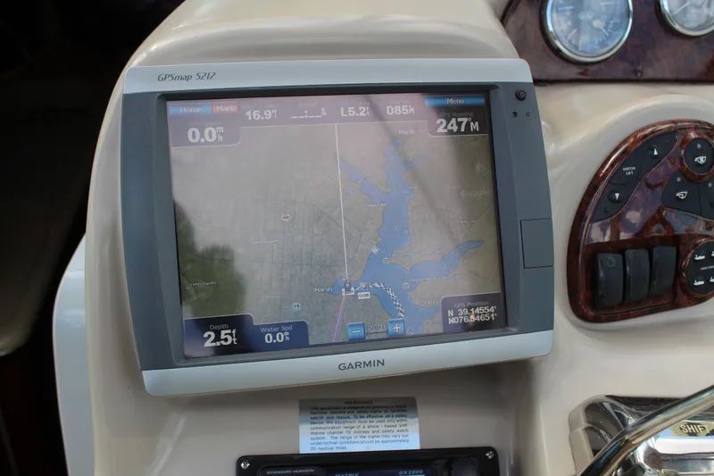 Slide: The Image of Garmin GPS display on 2004 Sea Ray 340 Sundancer boat dashboard, showing navigation map. - 23