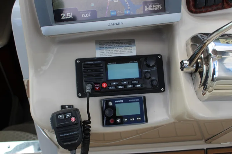 Slide: The Image of Control panel of a 2004 Sea Ray 340 Sundancer with Garmin navigation system. - 24