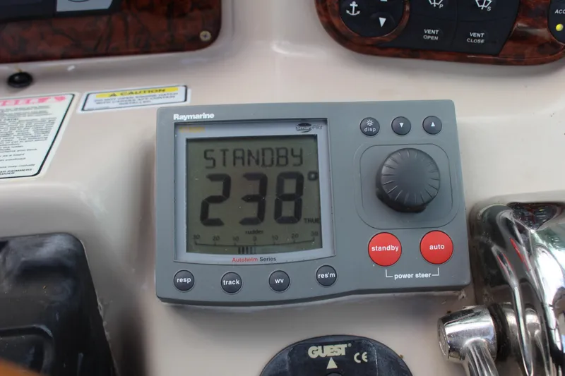 Slide: The Image of Raymarine autopilot control on 2004 Sea Ray 340 Sundancer boat dashboard. - 26