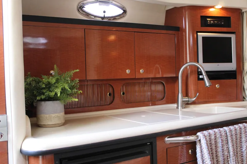 Slide: The Image of Luxurious 2004 Sea Ray 340 Sundancer yacht interior with modern kitchen amenities. - 28