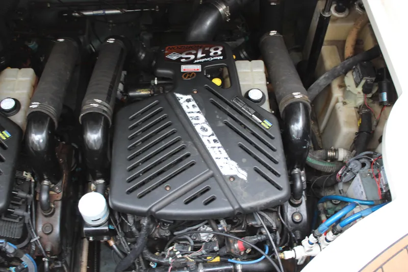 Slide: The Image of Engine compartment of a 2004 Sea Ray 340 Sundancer boat, featuring a MerCruiser 8.1S engine. - 37