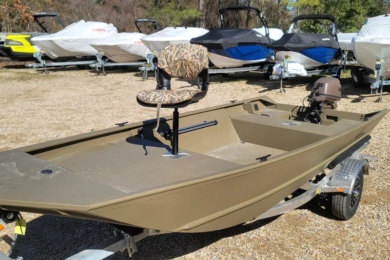 Slide: The Image of 2026 G3 Gator Tough 15 FL boat on trailer, featuring camo seat and outboard motor. - 7