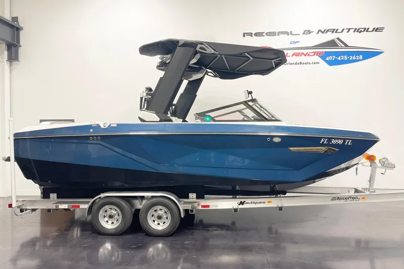 The Image of 2023 Nautique Super Air Nautique G23 boat on trailer in showroom. - 0