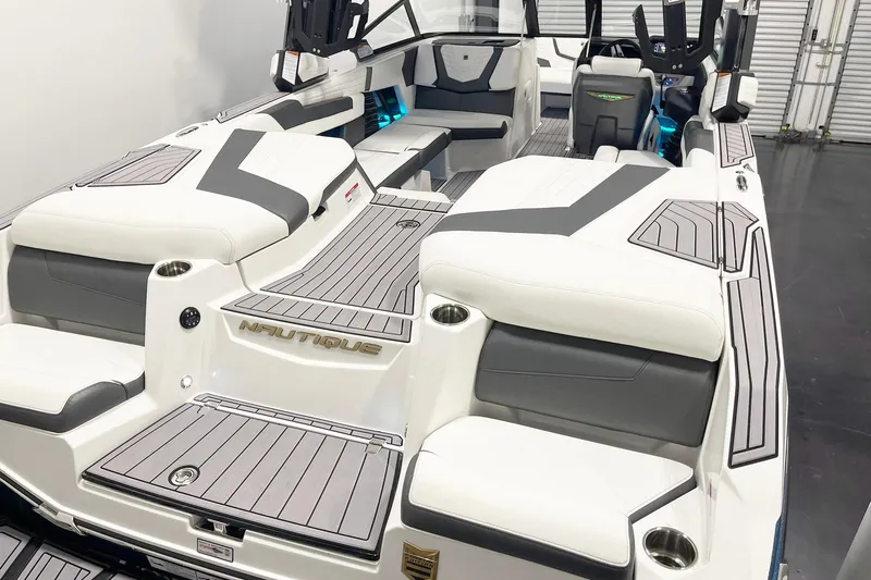 Slide: The Image of 2023 Nautique Super Air Nautique G23 boat interior with sleek seating and modern design. - 6
