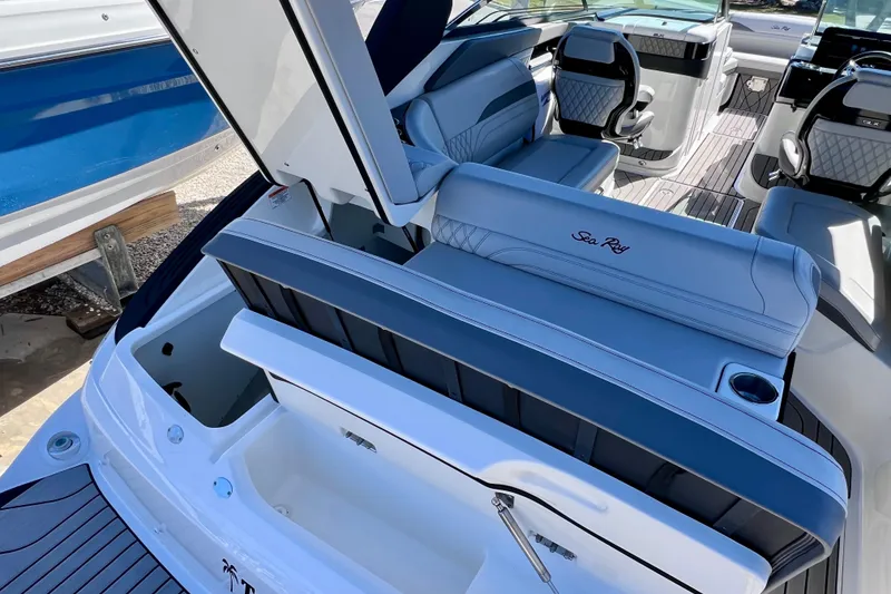 Slide: The Image of 2024 Sea Ray SLX 260 Outboard interior with luxurious seating and modern design. - 17