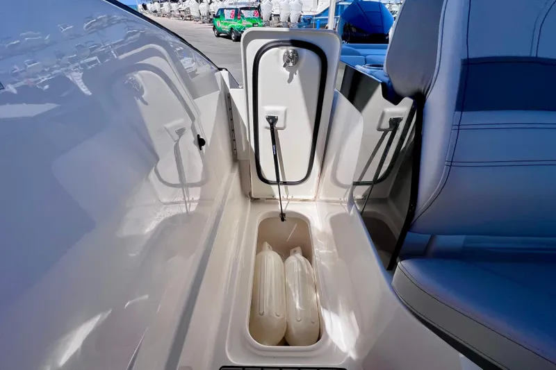 Slide: The Image of 2024 Sea Ray SLX 260 Outboard storage compartment with seating detail. - 23