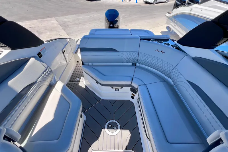 Slide: The Image of 2024 Sea Ray SLX 260 Outboard boat interior with luxurious seating and modern design. - 24