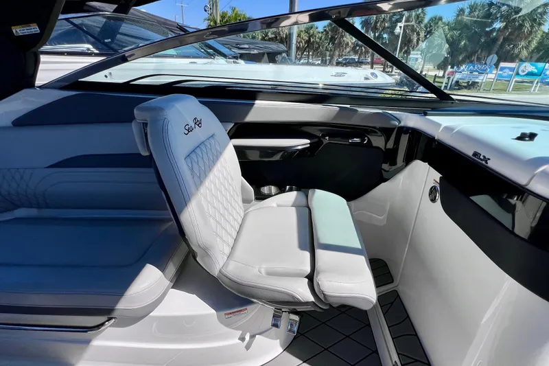 Slide: The Image of 2024 Sea Ray SLX 260 Outboard interior with luxurious seating and modern design. - 25