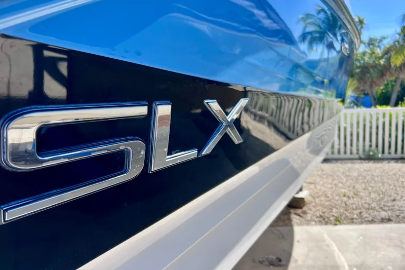 Slide: The Image of 2024 Sea Ray SLX 260 Outboard boat, close-up of sleek exterior design. - 3
