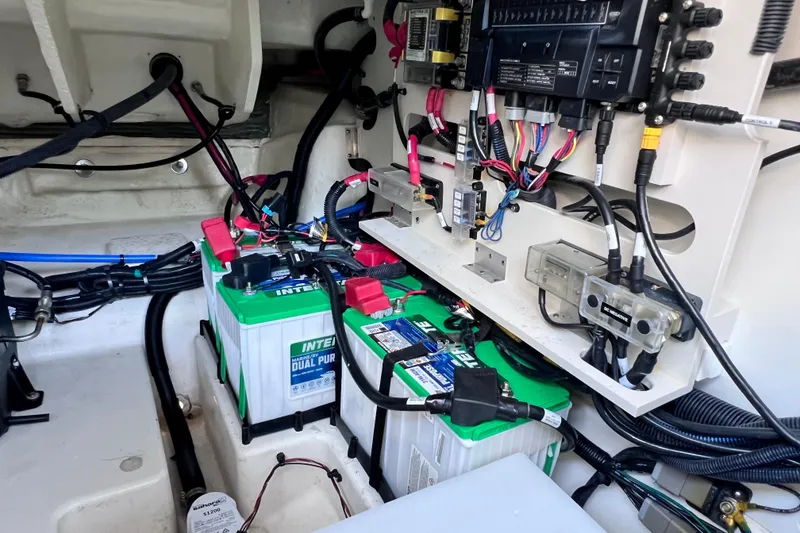 Slide: The Image of 2024 Sea Ray SLX 260 Outboard electrical system with dual batteries and wiring. - 30