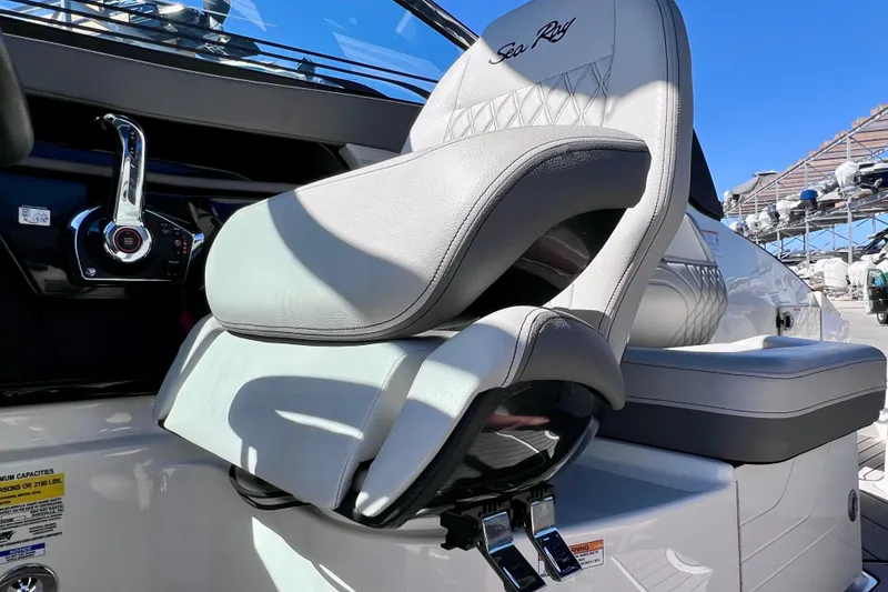 Slide: The Image of 2024 Sea Ray SLX 260 Outboard helm seat with luxurious design and controls. - 38